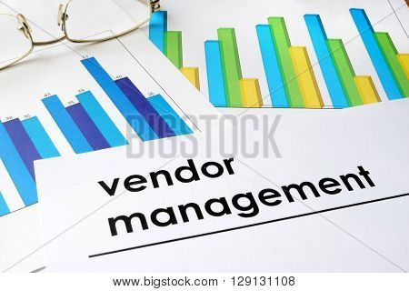 Paper with words Vendor management and charts.