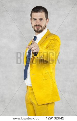 Businessman In A Gold Suit Pointing At You