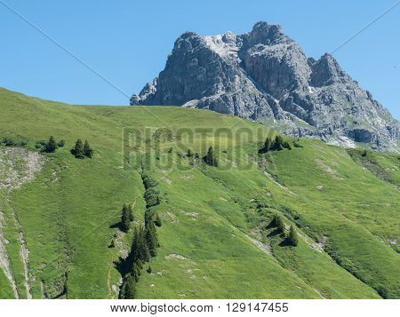A view of Alpine mountains surrounding the village Schroecken in Bregenzerwald region Vorarlberg Austria
