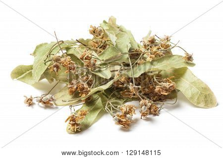 Dried linden flower Isolated on white background. The flowers resemble miniature umbrellas with yellowish color have a strong flavor and are used for making tea. Linden blossom has a disinfectant anti-inflammatory and diuretic.