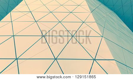 Abstract close-up view of modern aluminum ventilated facade of triangles