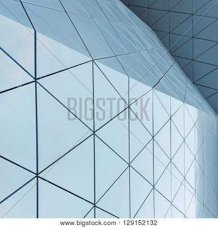 Abstract close-up view of modern aluminum ventilated facade of triangles