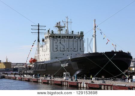 ST. PETERSBURG, RUSSIA - MAY 2, 2016: People at the icebreaker Mudyug during 3rd Icebreaker Festival. It's unique fest dedicated to icebreaker fleet