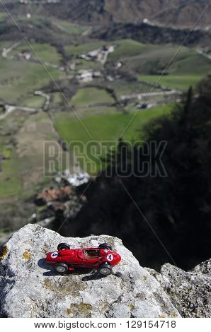 Scale model of famous red car and breathtaking panorama