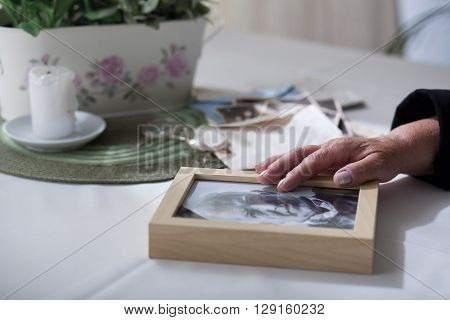 Elderly lady missing her dead husband much