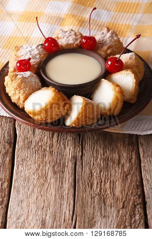 Dessert Leche Frita With Condensed Milk And Cherries Closeup. Vertical
