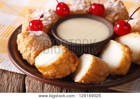 Dessert Leche Frita With Condensed Milk And Cherries Closeup. Horizontal