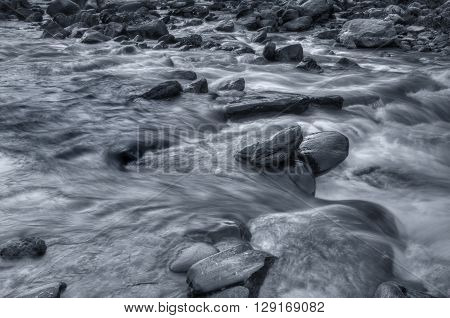Beautiful Reshi River water flowing through stones and rocks at dawn Sikkim India. Reshi is one of the most famous rivers of Sikkim flowing through the state and serving water to many local people.