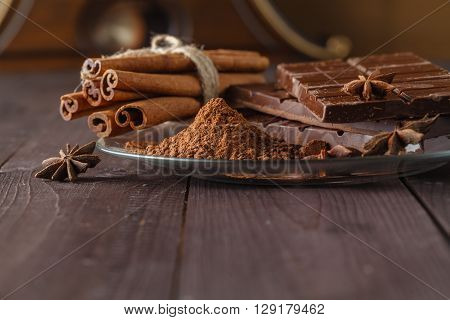 Cocoa And Chocolade On Wooden Table.