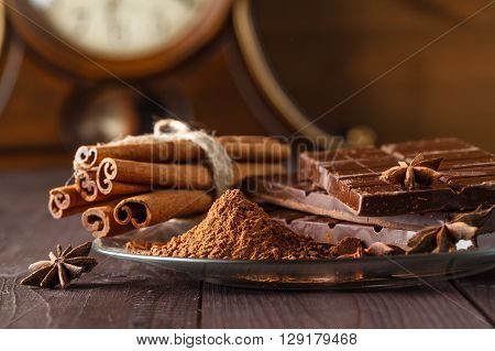 Cocoa And Chocolade On Wooden Table.