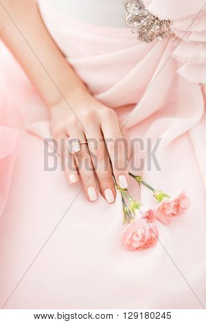 Pink Carnation flower in the hands of a girl