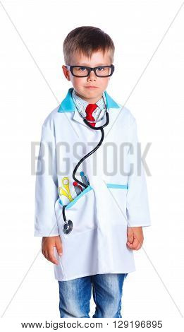 Adorable boy with clothes of doctor. Isolated on white background