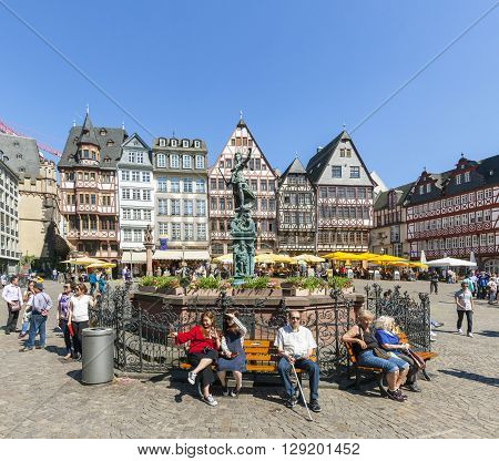 People Visit Romerberg (romerplatz) With Old Buildings  In Frankfurt