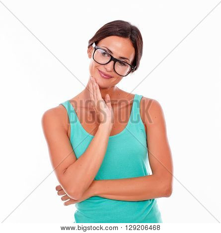 Contemplating Brunette Woman With Green Tank Top