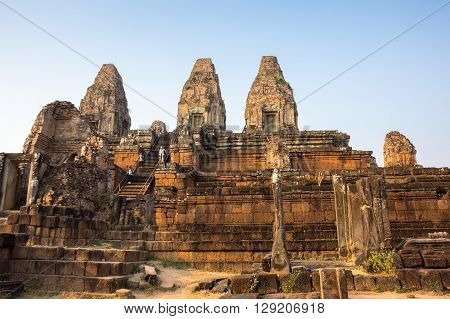 Phnom Bakheng at Angkor Cambodia is a Hindu and Buddhist temple in the form of a temple mountain dedicated to Shiva