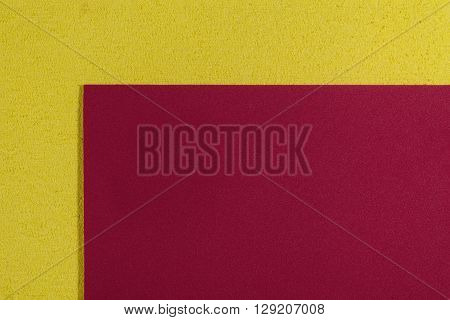 Eva foam ethylene vinyl acetate smooth red surface on lemon yellow sponge plush background
