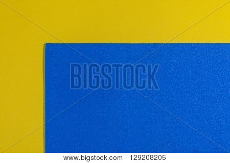 Eva foam ethylene vinyl acetate sponge plush blue surface on lemon yellow smooth background