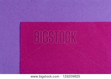 Eva foam ethylene vinyl acetate pink surface on light purple sponge plush background