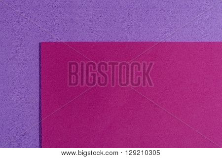 Eva foam ethylene vinyl acetate smooth pink surface on light purple sponge plush background