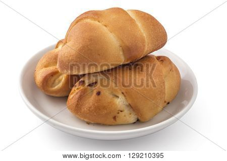 Fresh bavarian pastries rolls, kifla kiflice, on white plate, isolated on white background