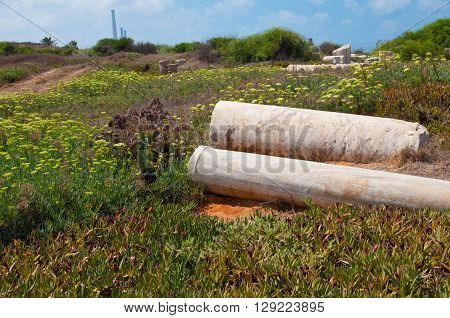 Two old ruined pillars at Caesarea, Israel.