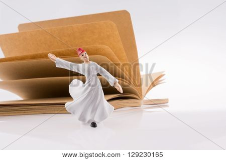 Sufi Dervish on a notebook on white background