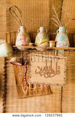 DARAW, EGYPT - FEBRUARY 6, 2016: Decorative colorful pottery in Palm tree decoration gallery.