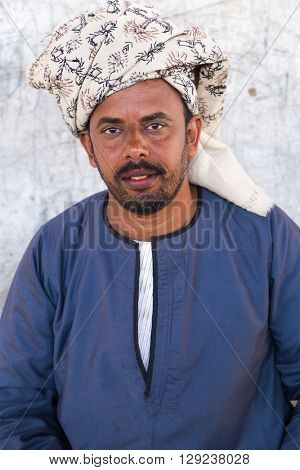 DARAW, EGYPT - FEBRUARY 6, 2016: Portrait of local camel salesman with turban.