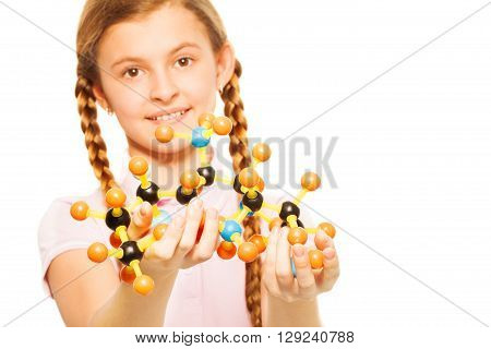 Portrait of teenage schoolgirl with molecular structure in her hands, isolated on white background