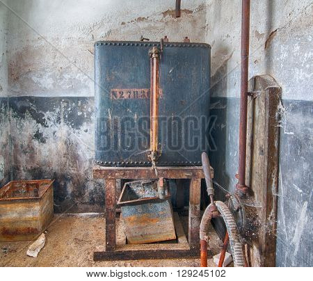 Image of the cellar in an industry building - old abandoned distillery of alcohol