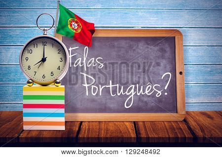 Digitally generated portugal national flag against wooden planks