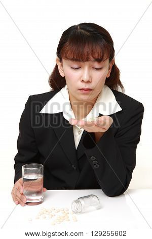 portrait of Asian businesswoman suffers from melancholy on white background