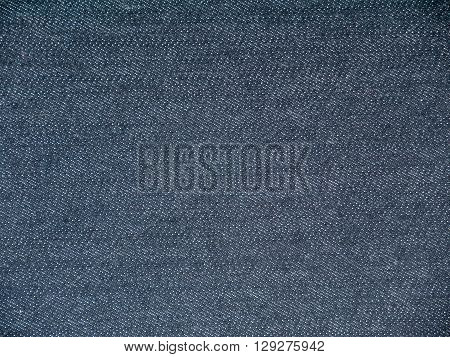 Dark rinse wash navy denim fabric background