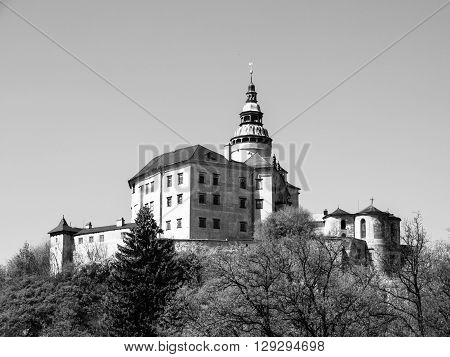 Frydlant v Cechach - Gothic castle and Renaissance chateau with high tower in northern Bohemia, Czech Republic. Black and white image.