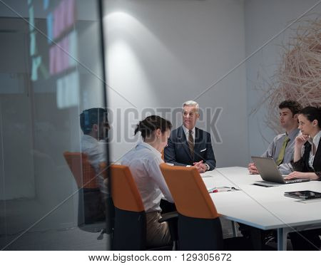 business people group brainstorming on meeting and businessman presenting ideas and projects oon laptop and tablet computer