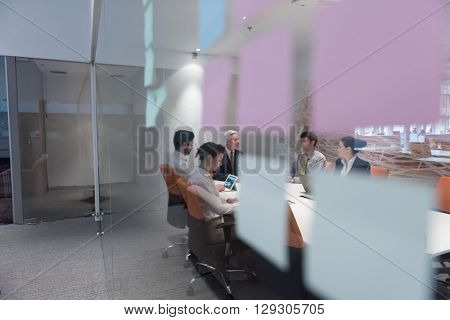 business people group brainstorming on meeting and businessman presenting ideas and projects oon laptop and tablet computer