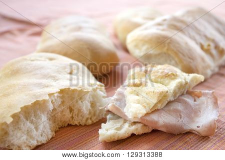 wedge of focaccia bread stuffed with mortadella