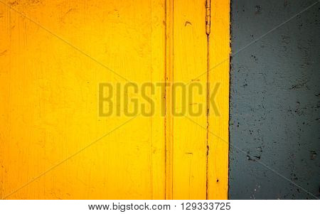 Close up wooden pattern of old yellow door