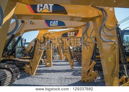 Litiz, PA USA - April 23, 2016: Caterpillar heavy equipment lined up at Caterpillar dealer. Caterpillar is one of the largest manufacturers of heavy construction & mining equipment in the world.