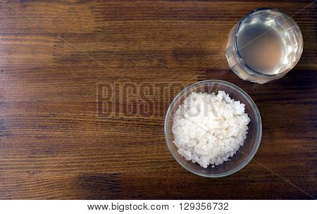 fungus - zooglea 'Indian Maritime rice' in a glass plate on a wooden background. Infusion of sea rice. Features: Immunomodulatory; Hypotensive (lowers blood pressure); Anti-sclerotic; Antimicrobial; Metabolic (improves metabolism); Diuretic.