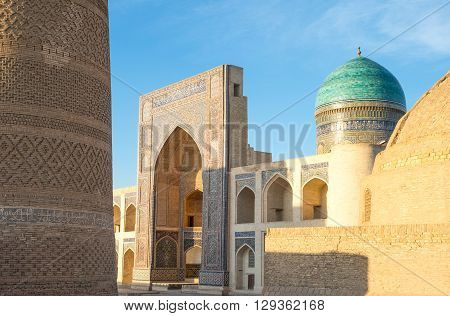 Uzbekistan Bukhara the Mir-i-Arab madrassah with the Kalon minaret on the left