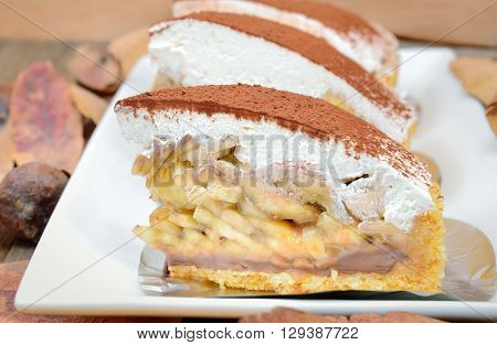 Banoffee pie on wooden table in soft light, Selective focus and close up