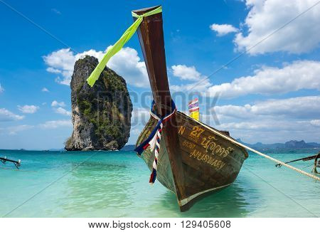 CRABI PROVINCE THAILAND - FEBRUARY 02 2015: Traditional thai long tail boat waiting for tourists to travel to beautiful islands in Thailand