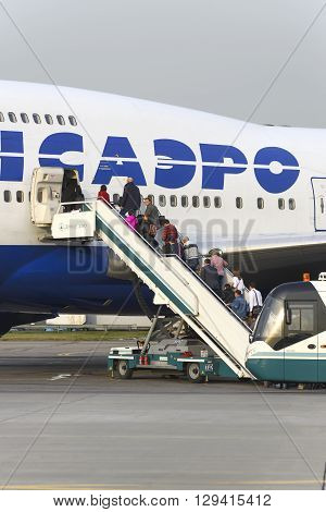 Passengers Board The Aircraft Boeing 747 Transaero Airlines