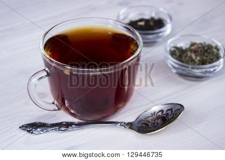 Hot tea cup with different sort of dried tea