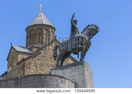 Tbilisi, Georgia - May 07: The Statue Of David The Builder In Front Of The Virgin Mary Metekhi Churc