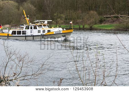 ESSEN NRW GERMANY - APRIL 4 2016: River supervisor boat Bussard MS at a check ride on the river Ruhr in Germany. Boat in use for water protection.