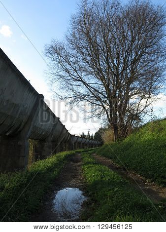 Elevated Concrete irrigation canal winding through countryside near Alora Andalucia