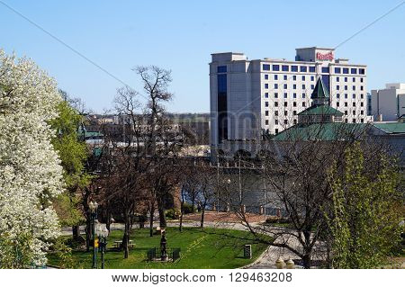 JOLIET, ILLINOIS / UNITED STATES - APRIL 26, 2015: Asi view of downtown Joliet, Illinois, and of the riverfront, from the top of the bluff above Billie Limacher Bicentennial Park.
