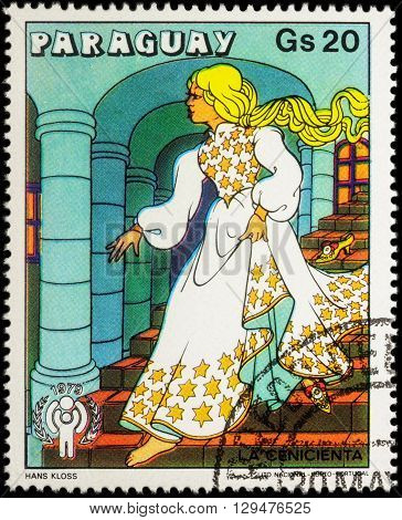 MOSCOW RUSSIA - MAY 11 2016: A stamp printed in Paraguay shows Cinderella in palace - scene from a fairy tale series 